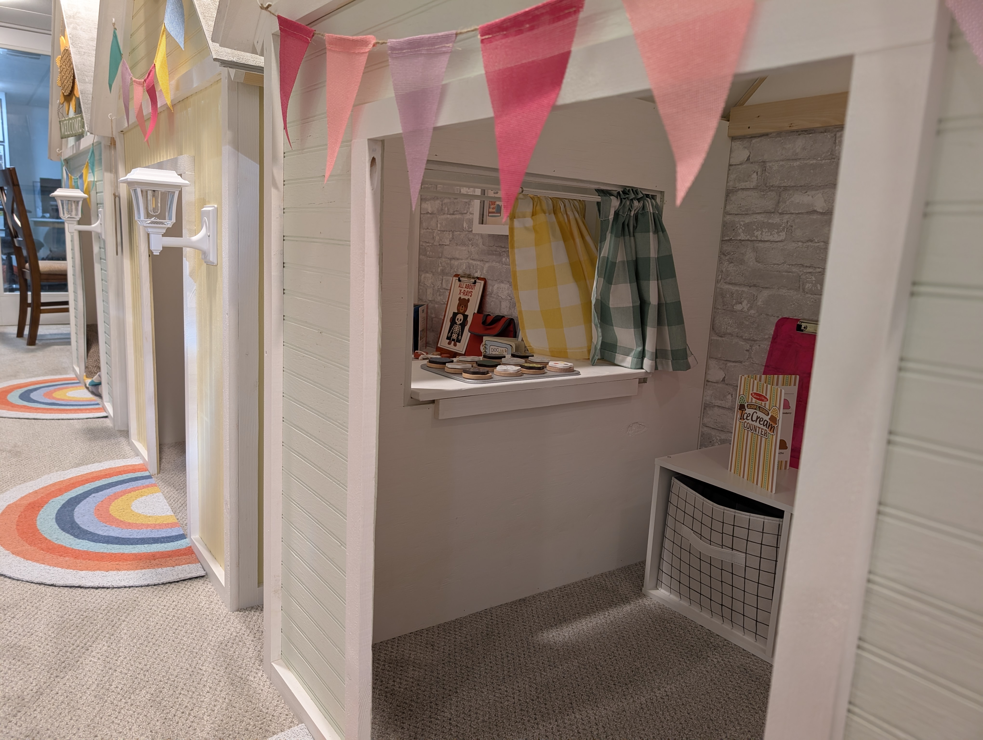 Detailed close-up of custom playhouse showing window trim and craftsmanship