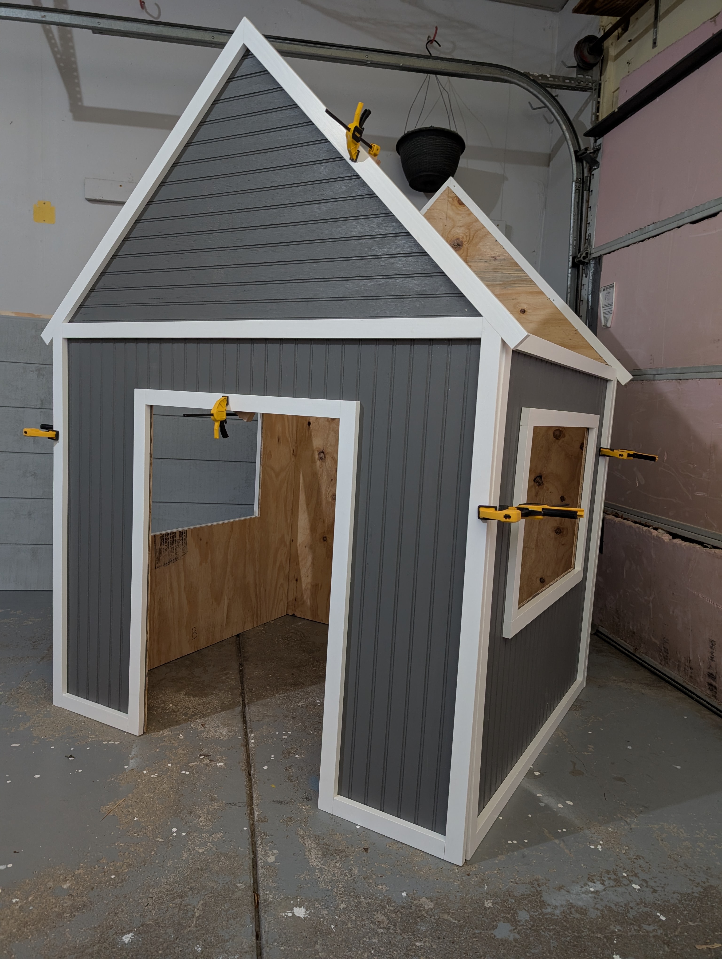 Completed playhouse showing the final result of building from DIY plans